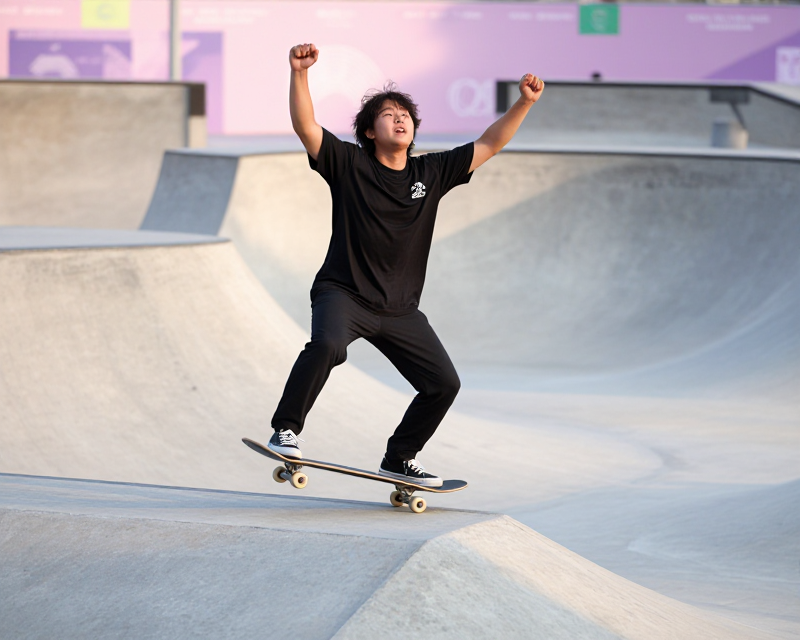 Triumphant Korean Skateboarder